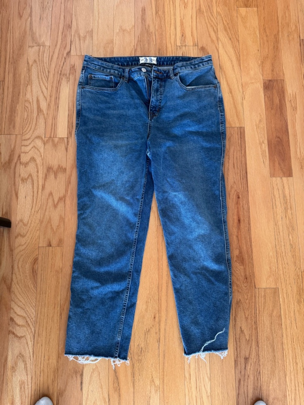 We The Free Relaxed Boyfriend Jeans in Medium Blue with Frayed Hem